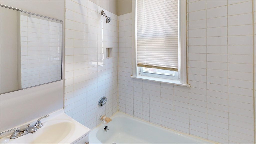 52 Sumner Street, Unit 3 Revere, MA 02151 - Photo 4 of 7 a bathroom with a bathtub and shower