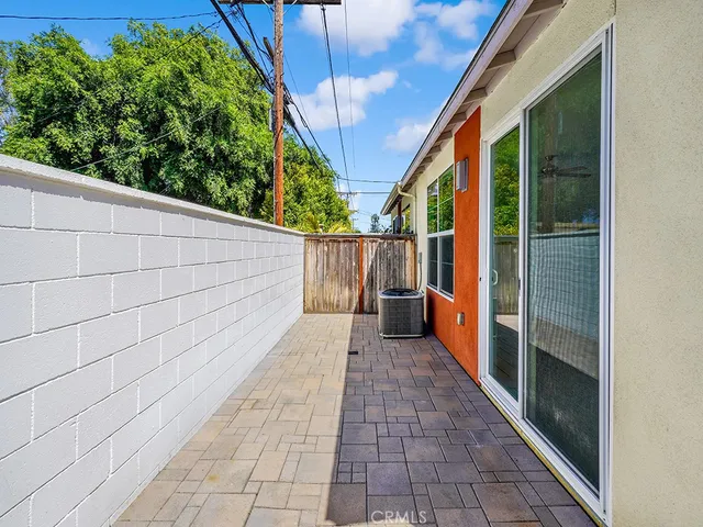 a view of a pathway with a balcony