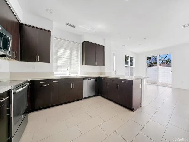 a large kitchen with a large counter top