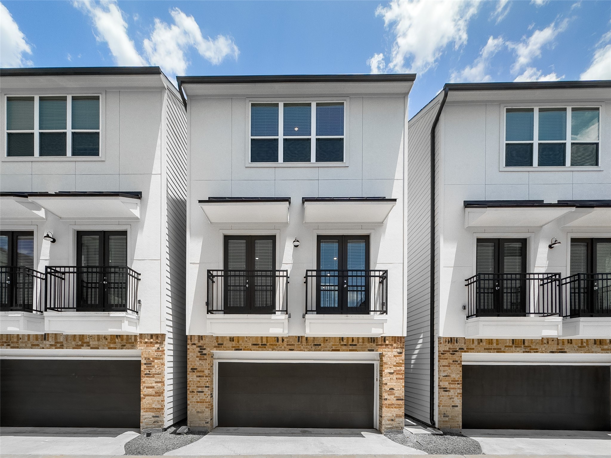 1250 North Post Oak Road, Unit A Houston, TX 77055 - Photo 1 of 31 Front view of home with large windows and private balconies, offering a sophisticated curb appeal.