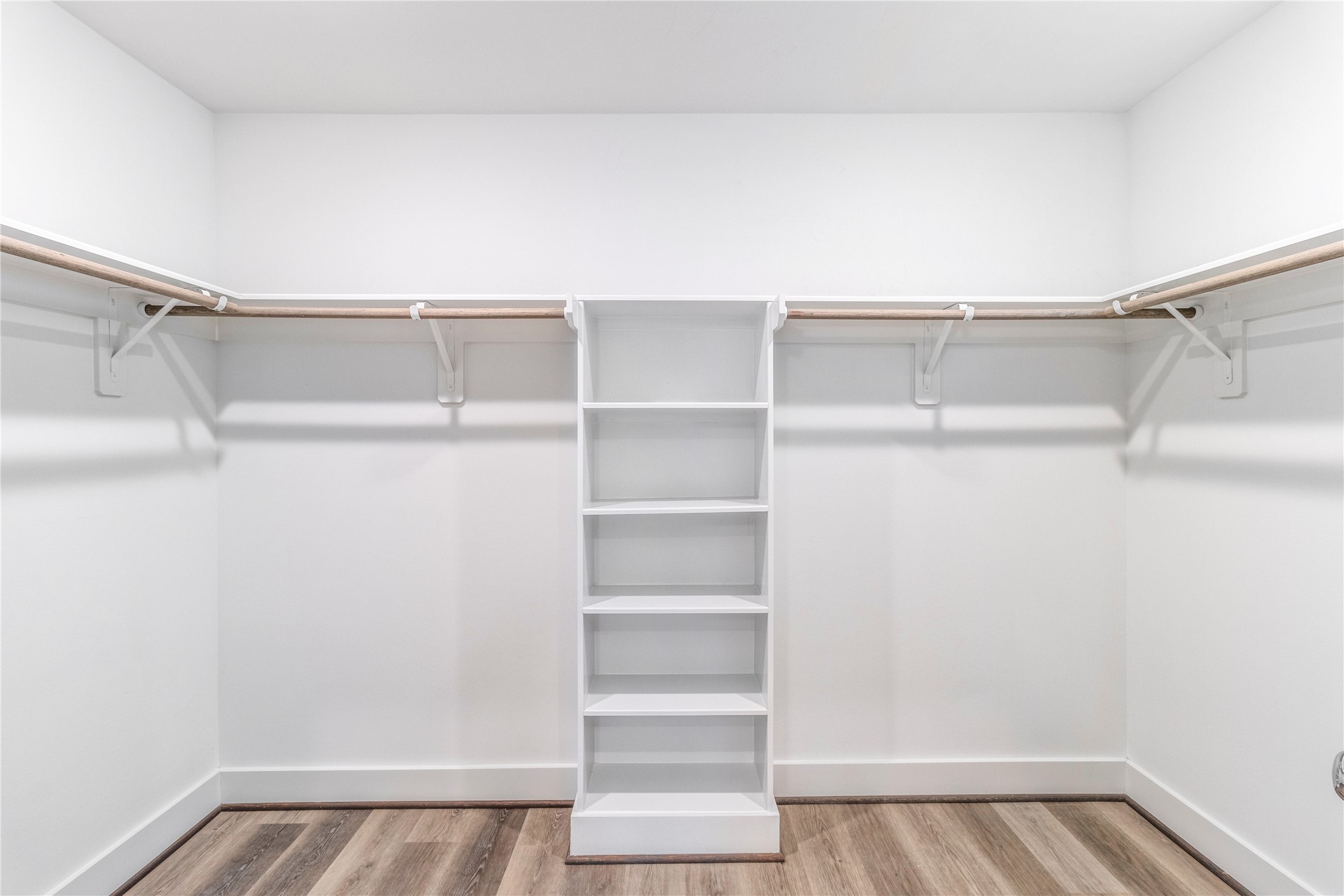 1250 North Post Oak Road, Unit A Houston, TX 77055 - Photo 17 of 31 Spacious walk-in closet with ample storage solutions.