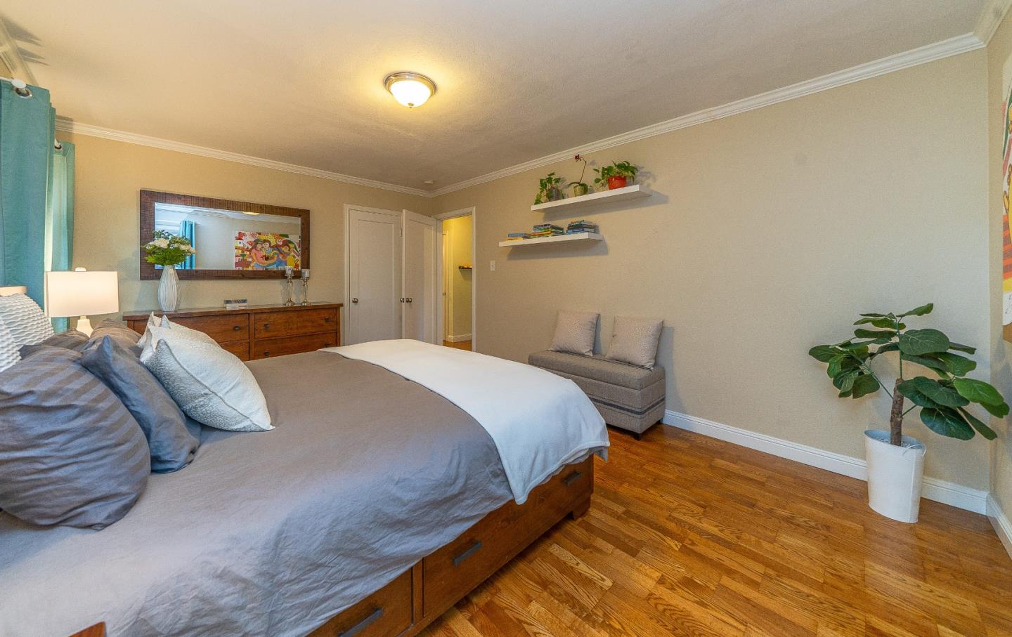 1896 Ellen Avenue San Jose, CA 95125 - Photo 22 of 50 a bedroom with a bed and a potted plant