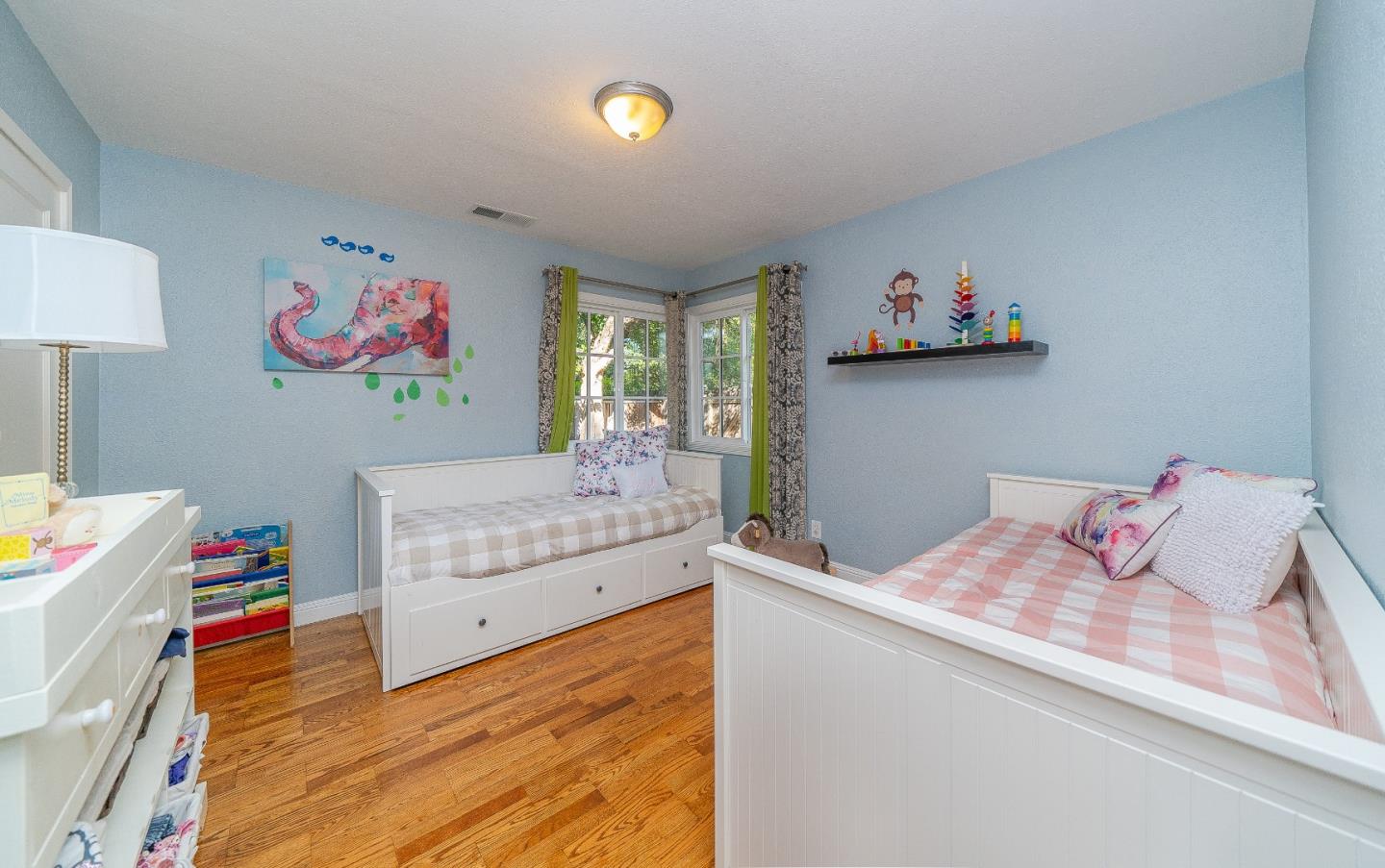1896 Ellen Avenue San Jose, CA 95125 - Photo 23 of 50 a bedroom with a bed and a dresser in it