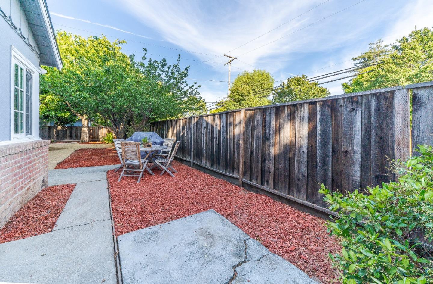 1896 Ellen Avenue San Jose, CA 95125 - Photo 30 of 50 a backyard of a house with chairs and a fence