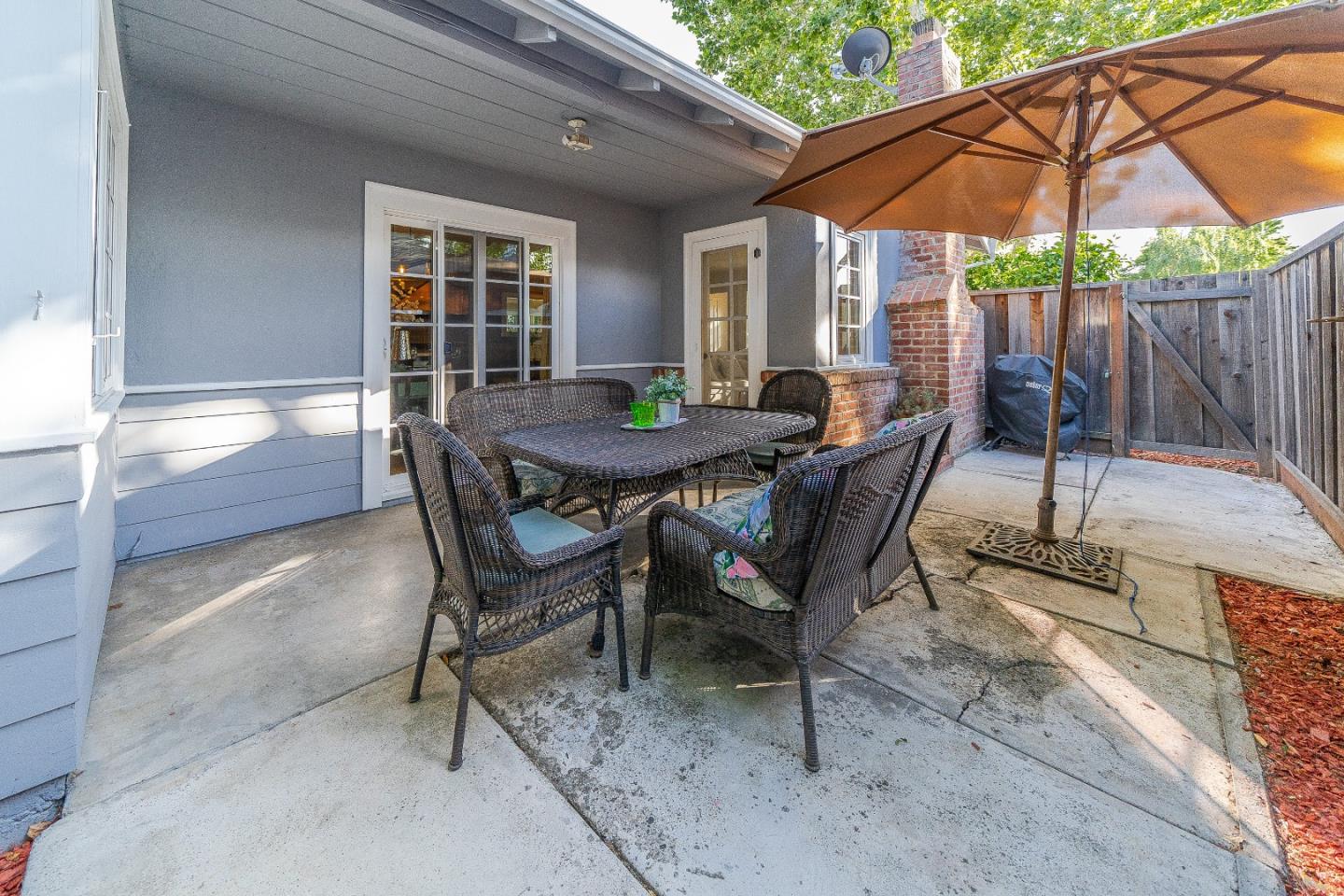 1896 Ellen Avenue San Jose, CA 95125 - Photo 32 of 50 a view of a patio with a table and chairs under an umbrella