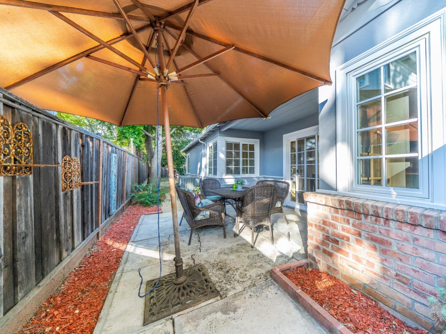 1896 Ellen Avenue San Jose, CA 95125 - Photo 33 of 50 a view of a patio with a table and chairs under an umbrella
