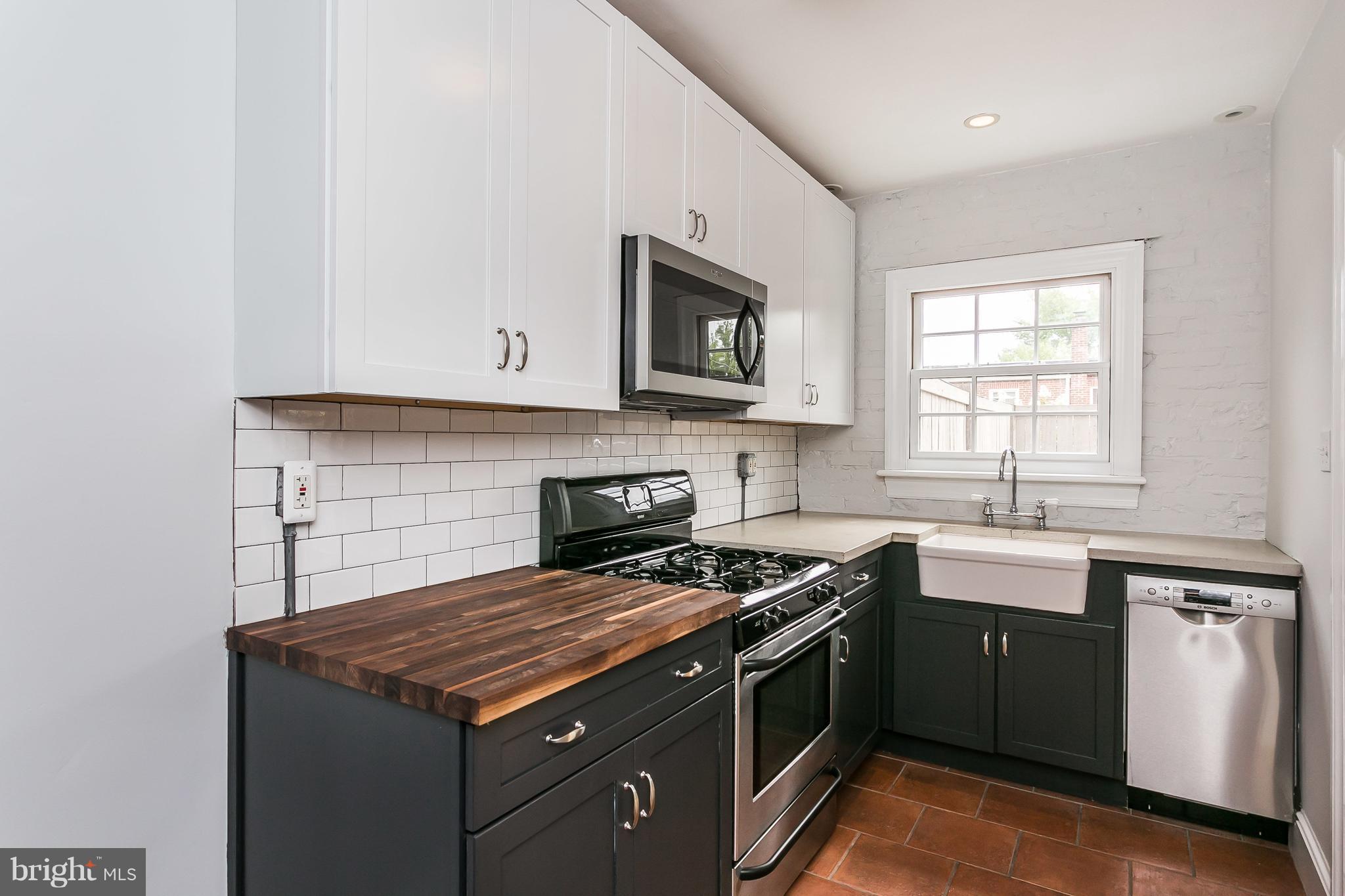 3723 Rexmere Road Baltimore, MD 21218 - Photo 14 of 30 Mod 2-tone cabs, farmerhouse sink, exposed brick.