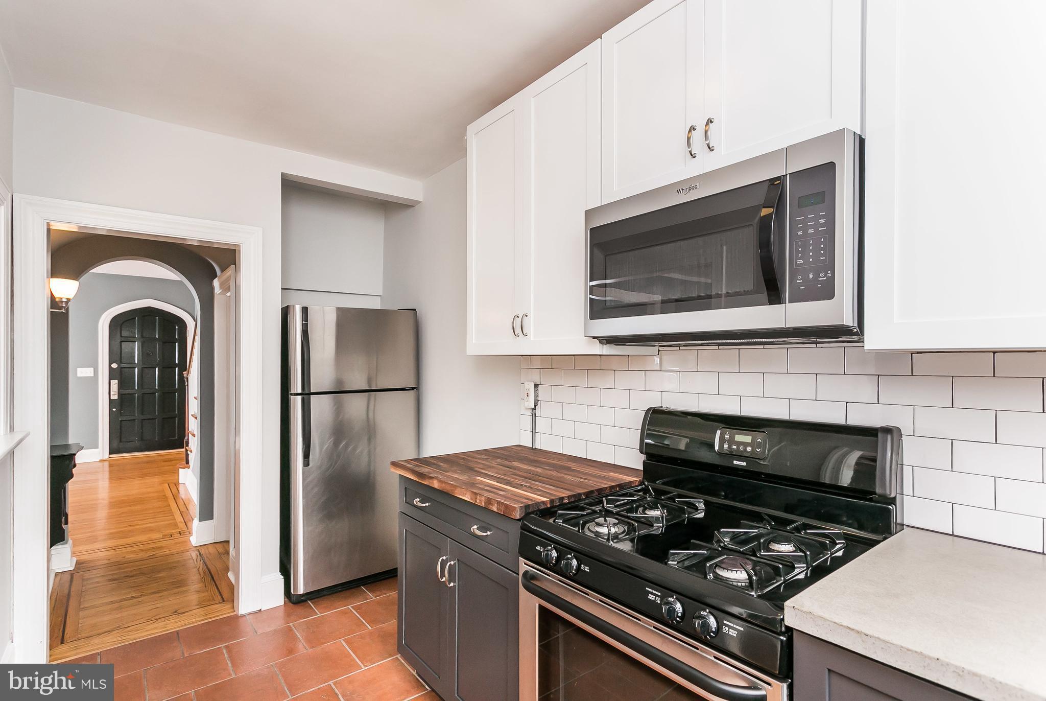 3723 Rexmere Road Baltimore, MD 21218 - Photo 15 of 30 Subway tile, SS apps, butcher block/concrete tops!