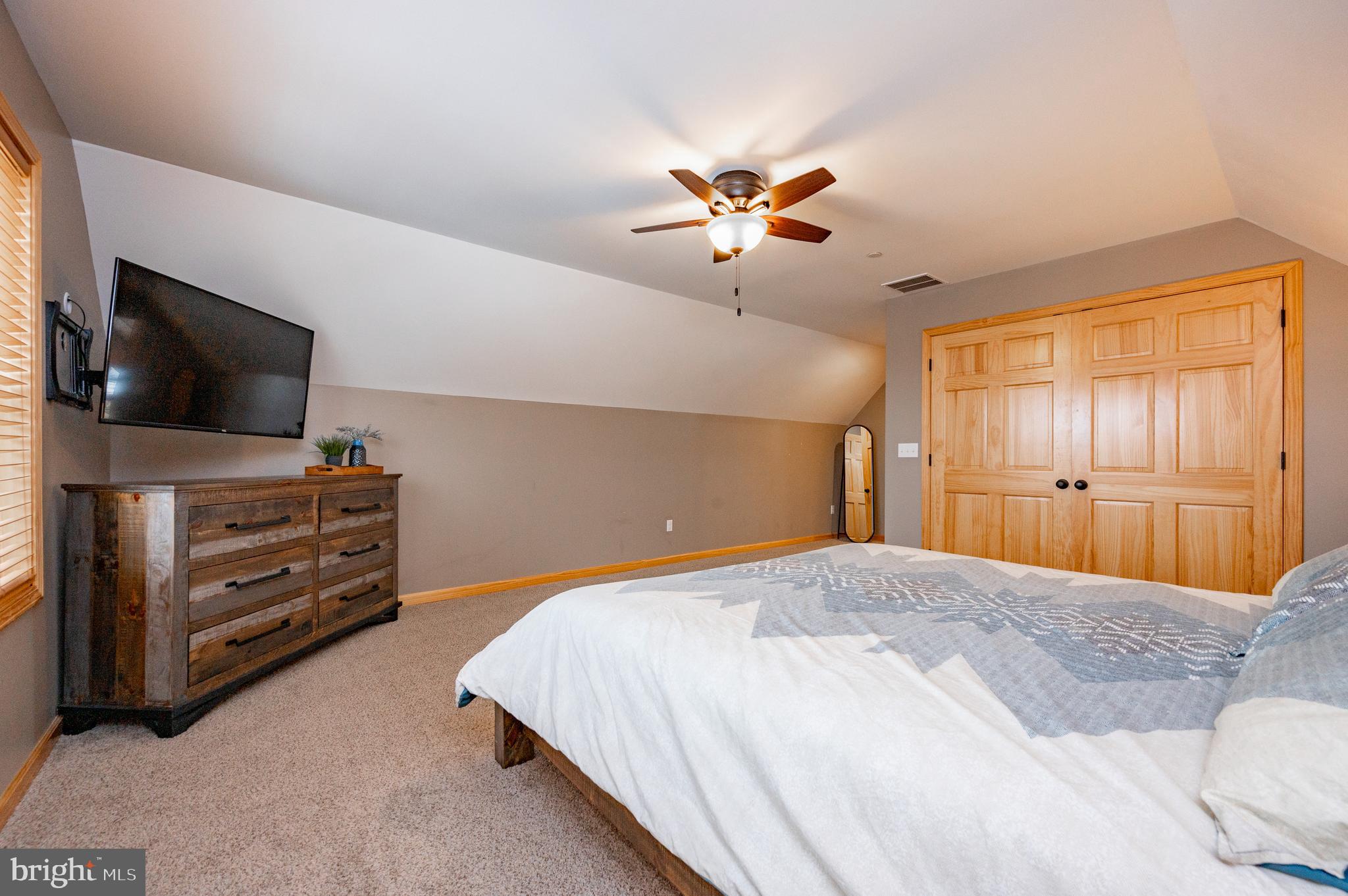 226 Wisp Adventure Road McHenry, MD 21541 - Photo 58 of 67 a bedroom with a bed and a flat screen tv