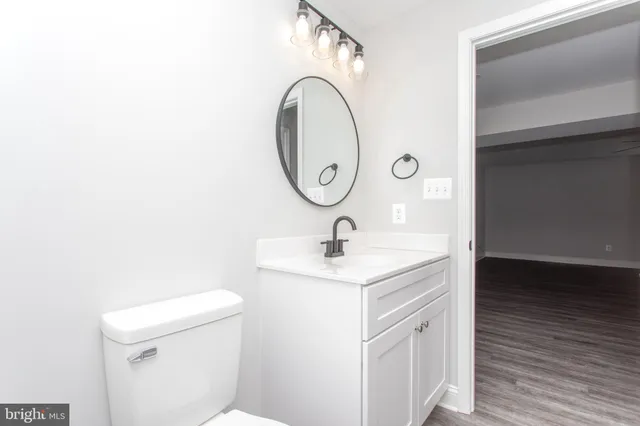 a view of empty room with wooden walls