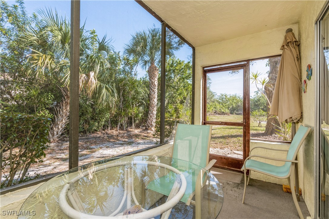 8049 Country Road, Unit 102 Fort Myers, FL 33919 - Photo 14 of 23 a living room with a couch and chairs