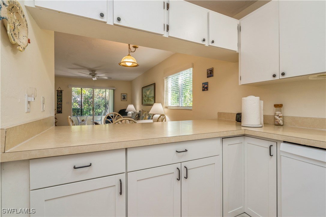 8049 Country Road, Unit 102 Fort Myers, FL 33919 - Photo 9 of 23 a kitchen with cabinets and window
