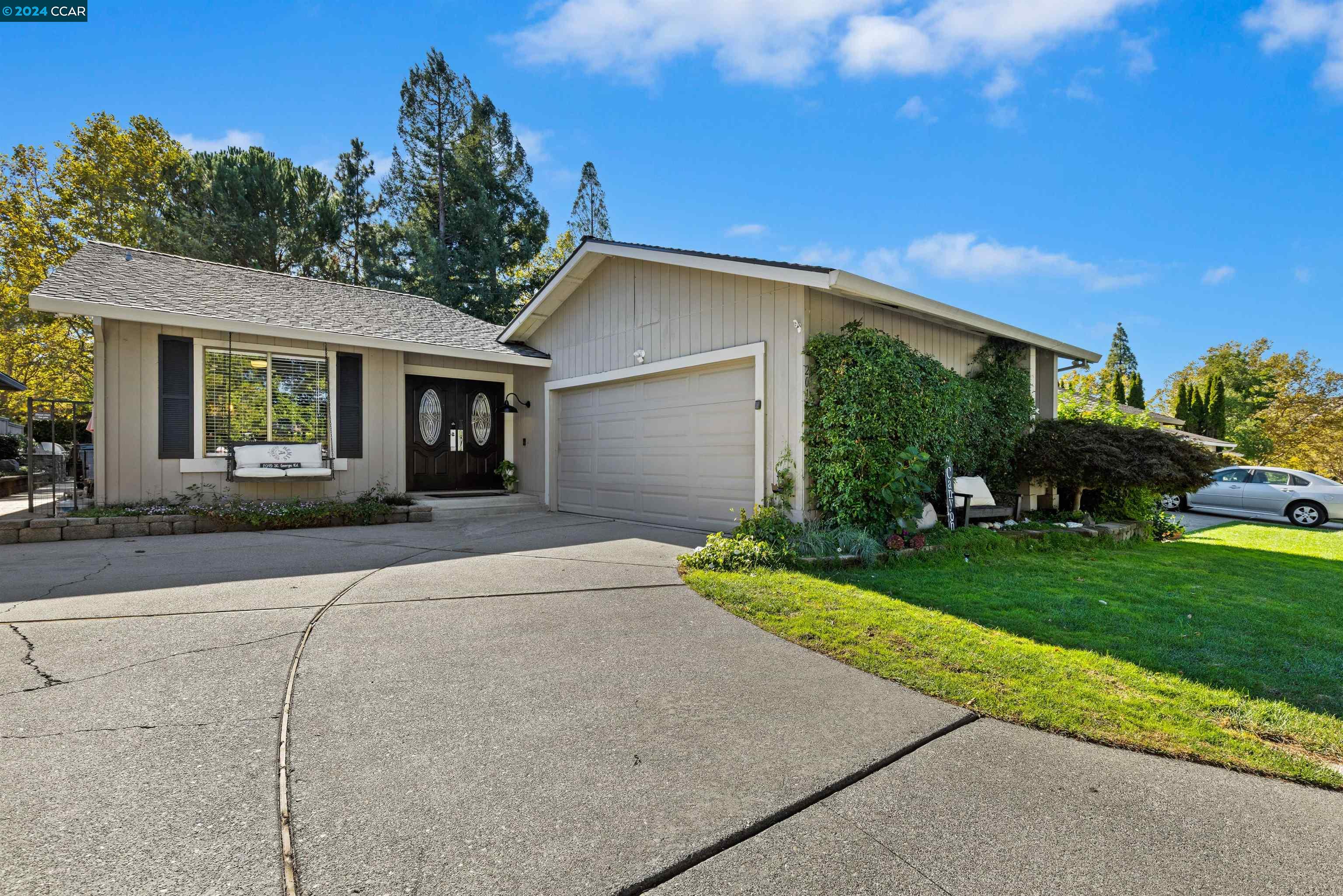 2015 St George Road Danville, CA 94526 - Photo 1 of 1 a front view of a house with a yard and garage