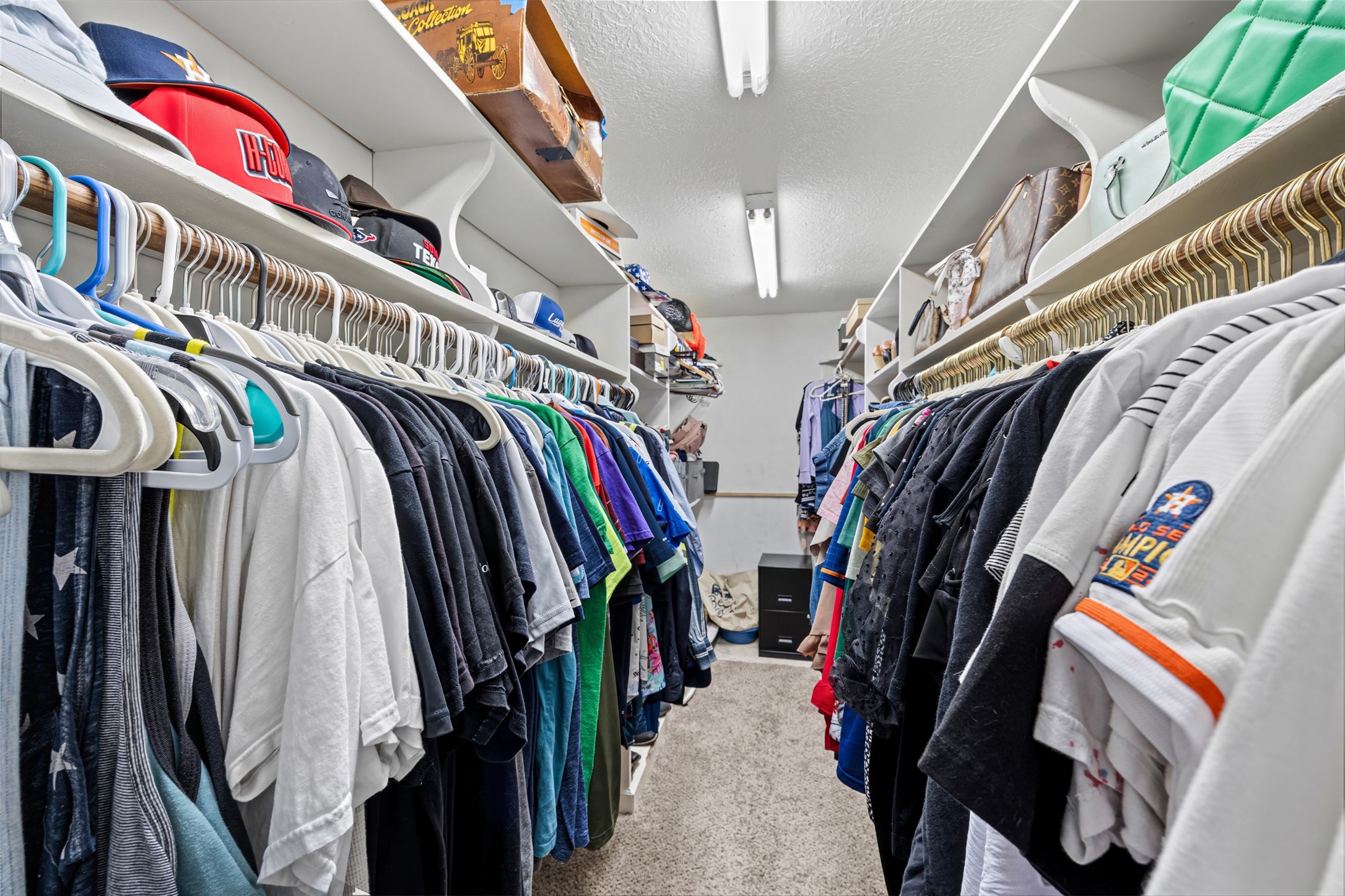 3700 September Drive Baytown, TX 77521 - Photo 19 of 30 a view of walk in closet with clothes and shoes