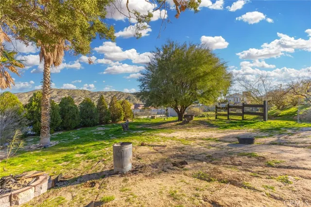 a view of a yard with swimming pool