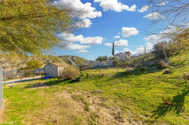 a view of a yard with an outdoor space
