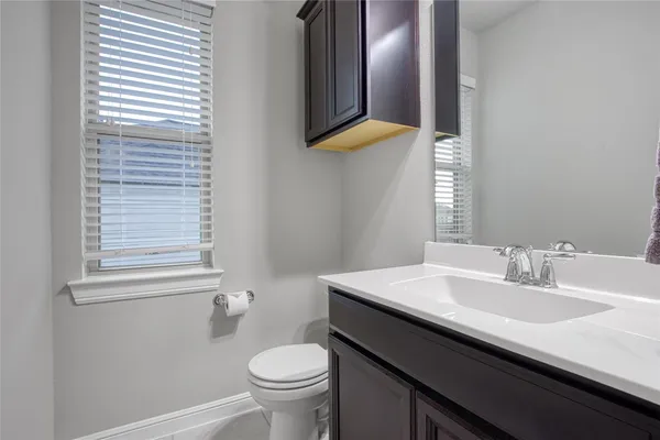 a en suite bathroom with a double vanity sink a and mirror