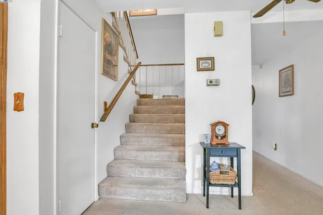 a bedroom with a bed couch and window