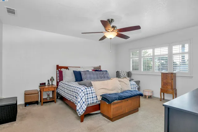 a en suite bathroom with a tub sink and mirror
