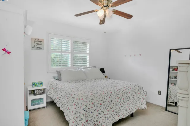 a bedroom with a bed and a cabinets