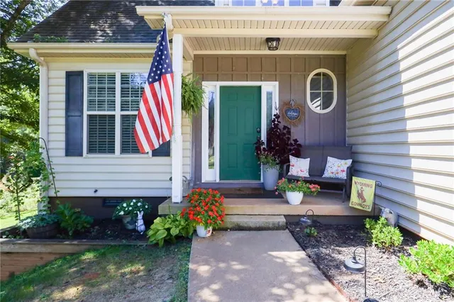 a view of a room with gym equipment and a window