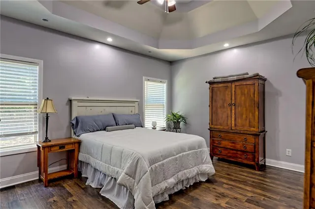a kitchen with a sink a window and chairs