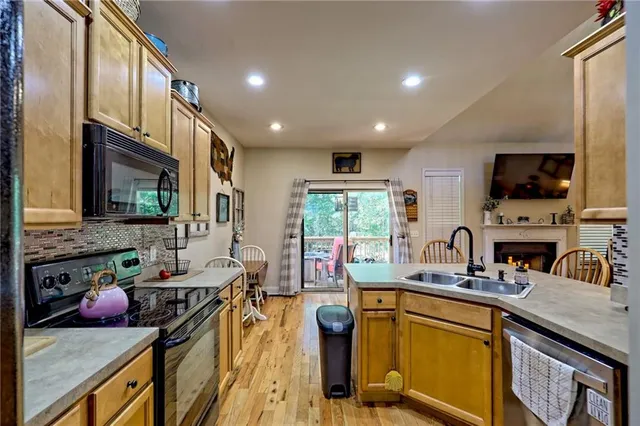 a view of balcony with wooden floor and fence