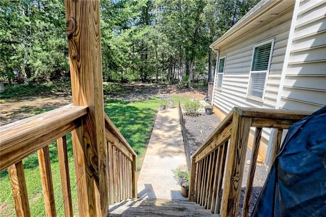 a view of a house with a yard and garage