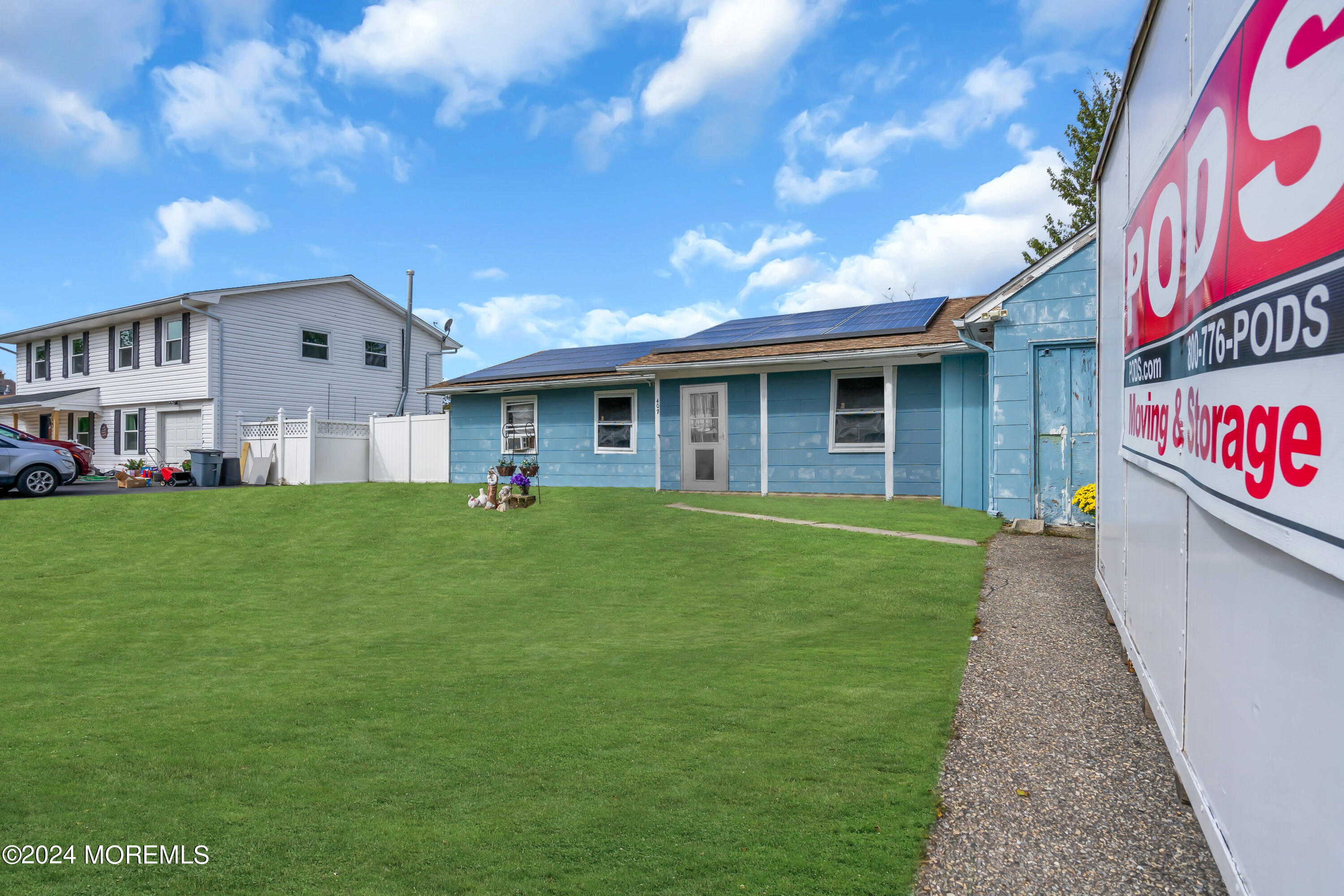 407 6th Street Waretown, NJ 08758 - Photo 3 of 9 a front view of a house with a yard