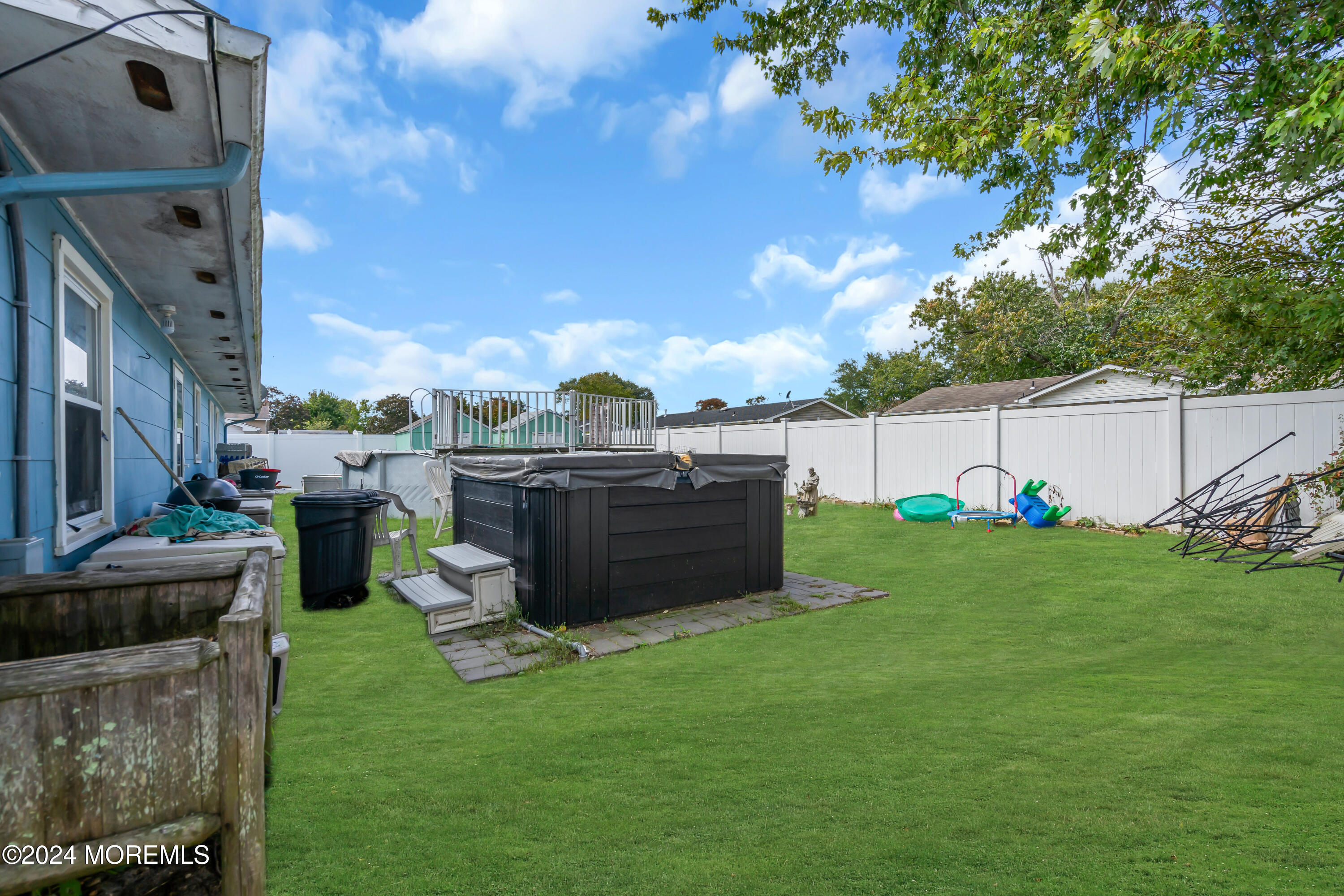 407 6th Street Waretown, NJ 08758 - Photo 4 of 9 a view of a garden with an outdoor seating