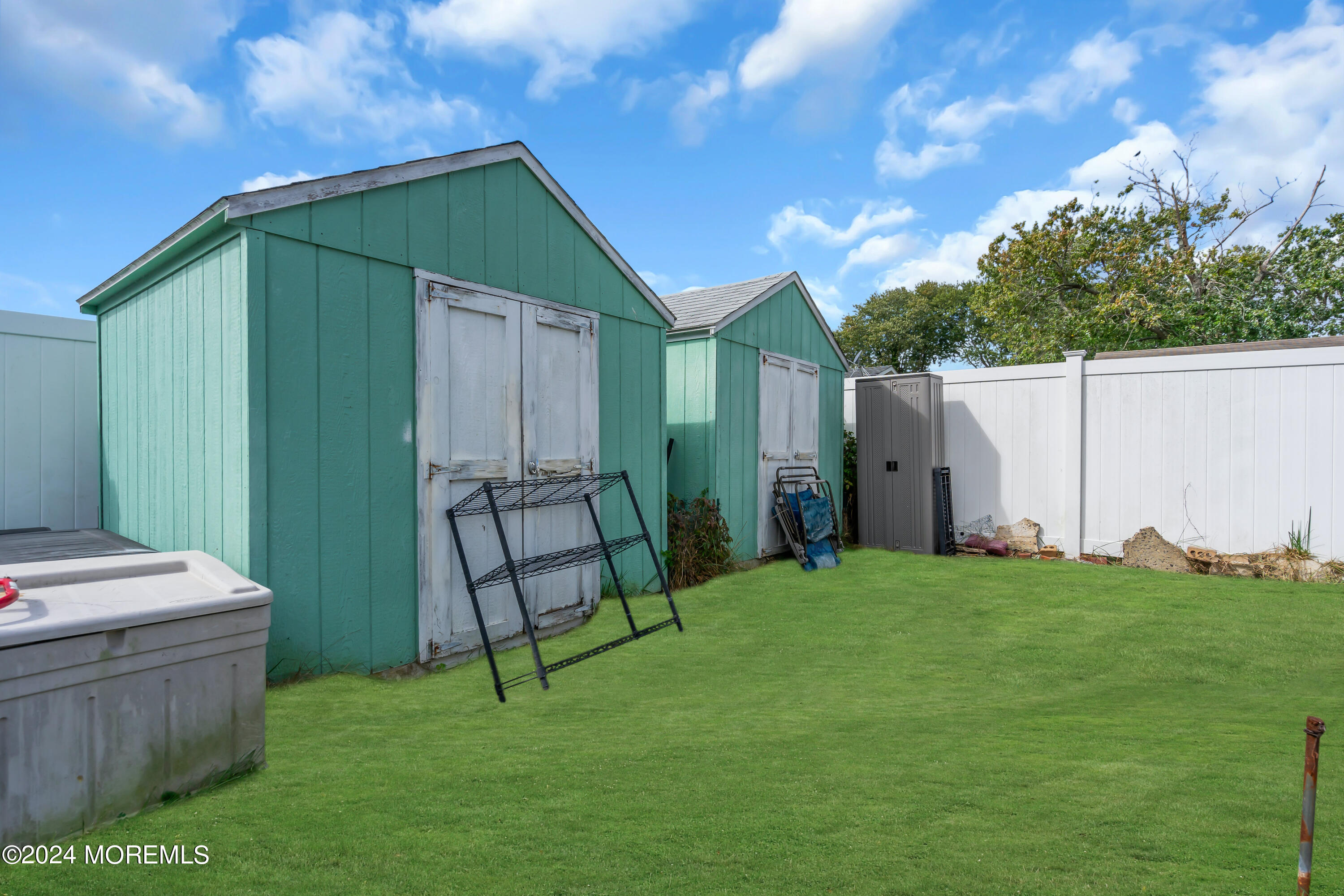 407 6th Street Waretown, NJ 08758 - Photo 8 of 9 a backyard of a house with barbeque oven