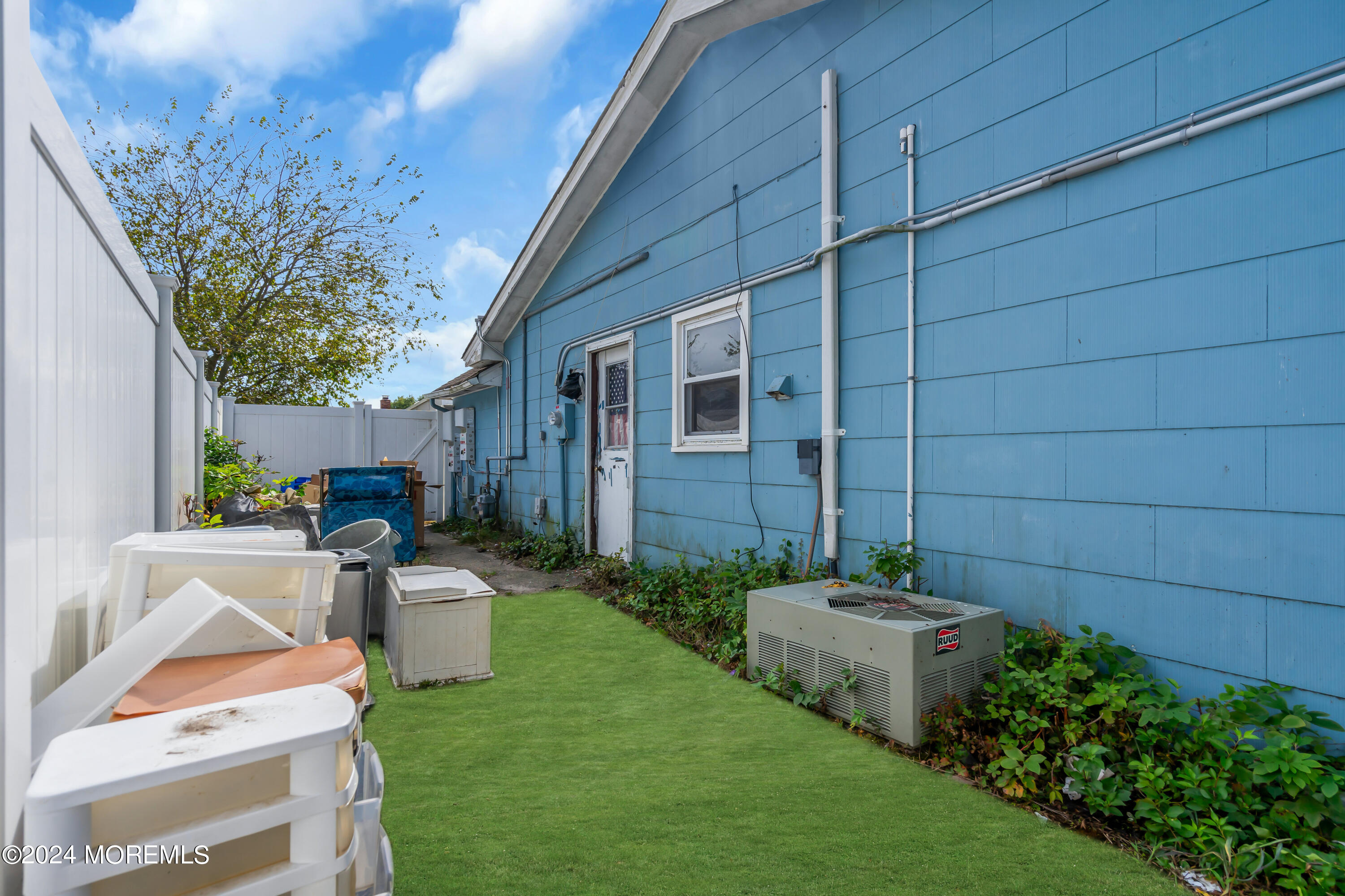407 6th Street Waretown, NJ 08758 - Photo 9 of 9 a backyard of a house with table and chairs with plants