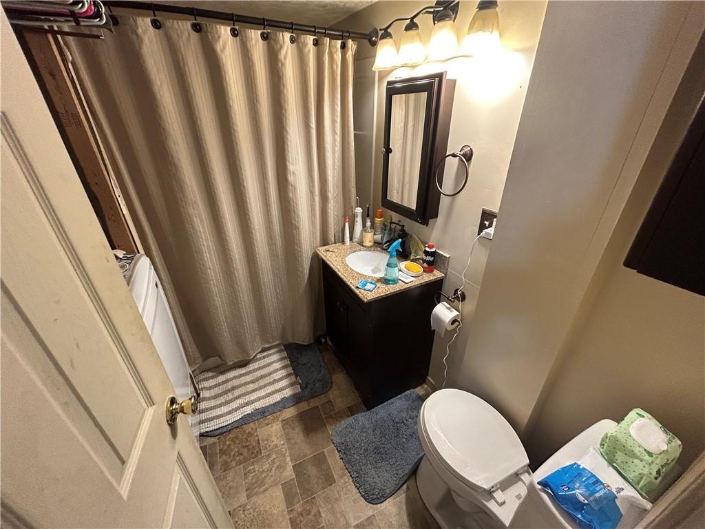 203 2nd Street Brownfield, PA 15416 - Photo 11 of 27 a bathroom with a sink toilet and shower