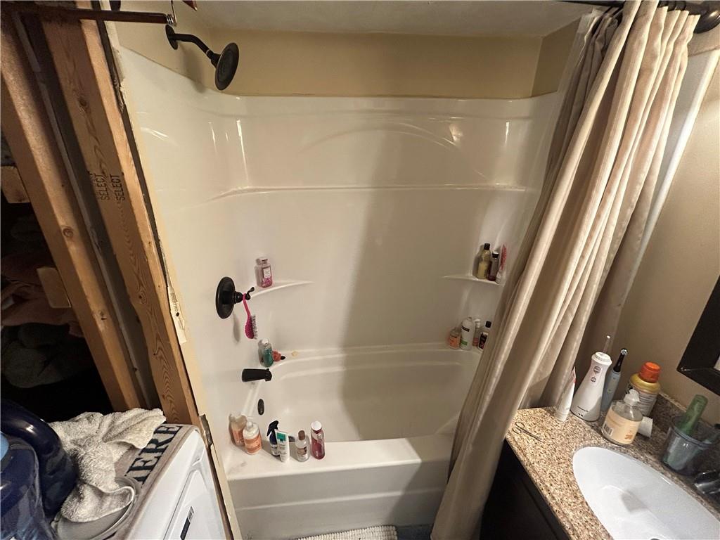 203 2nd Street Brownfield, PA 15416 - Photo 12 of 27 a bathroom with a sink and a tub