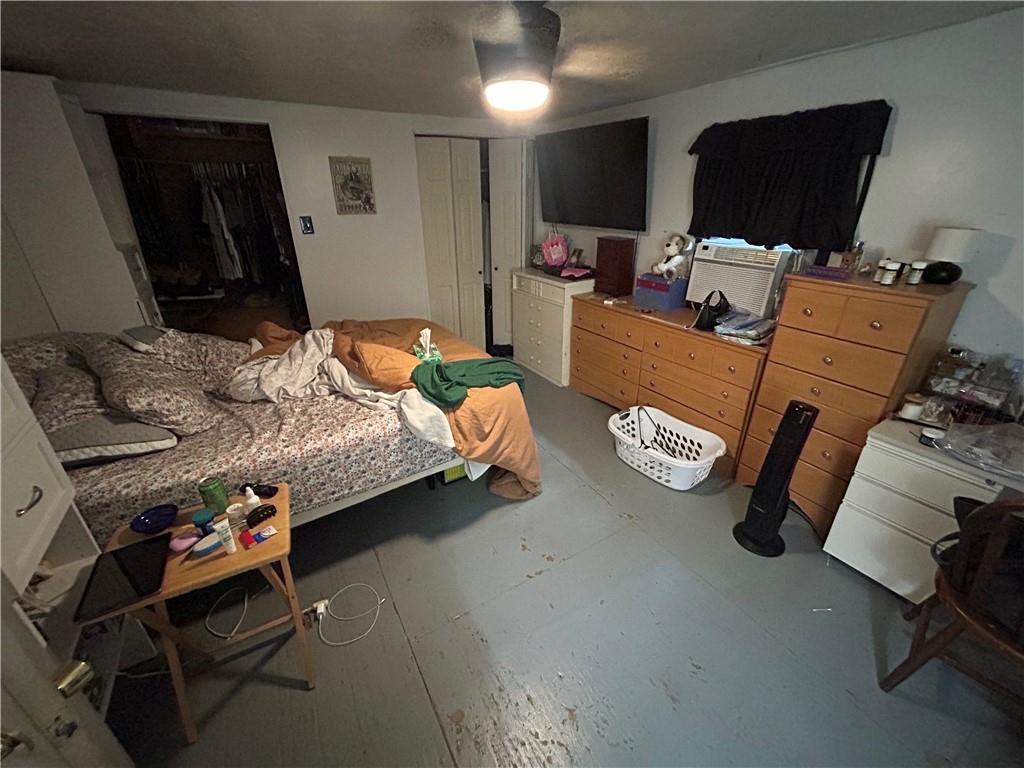 203 2nd Street Brownfield, PA 15416 - Photo 15 of 27 a bedroom with furniture and a flat screen tv