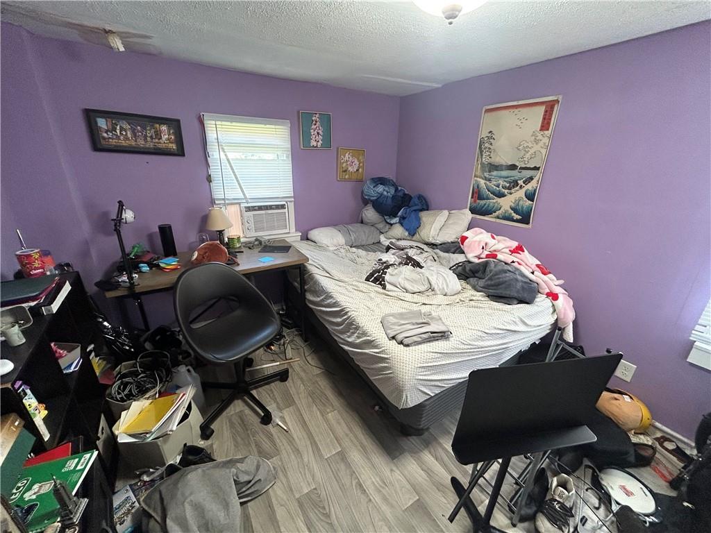 203 2nd Street Brownfield, PA 15416 - Photo 17 of 27 a bed room with a bed and a chair