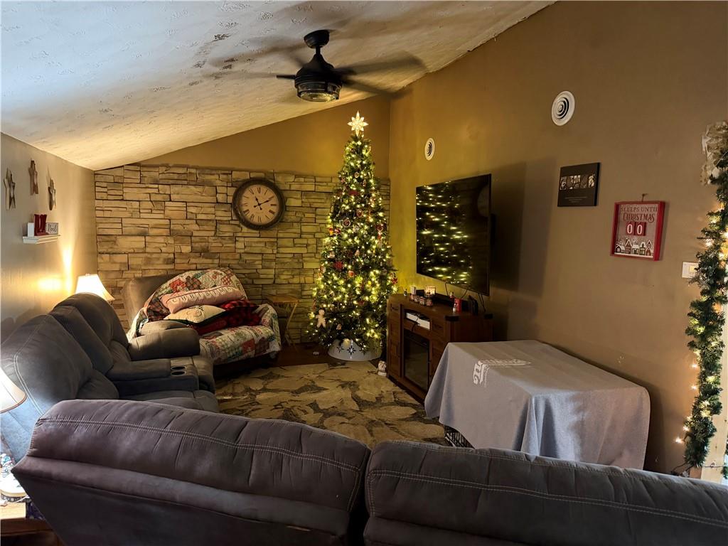 203 2nd Street Brownfield, PA 15416 - Photo 2 of 27 a living room with furniture and a clock