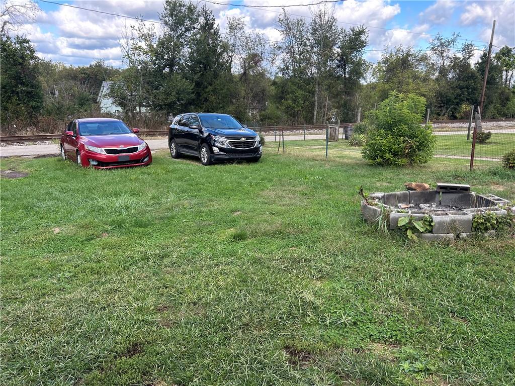 203 2nd Street Brownfield, PA 15416 - Photo 22 of 27 a couple of cars parked in big yard with green space