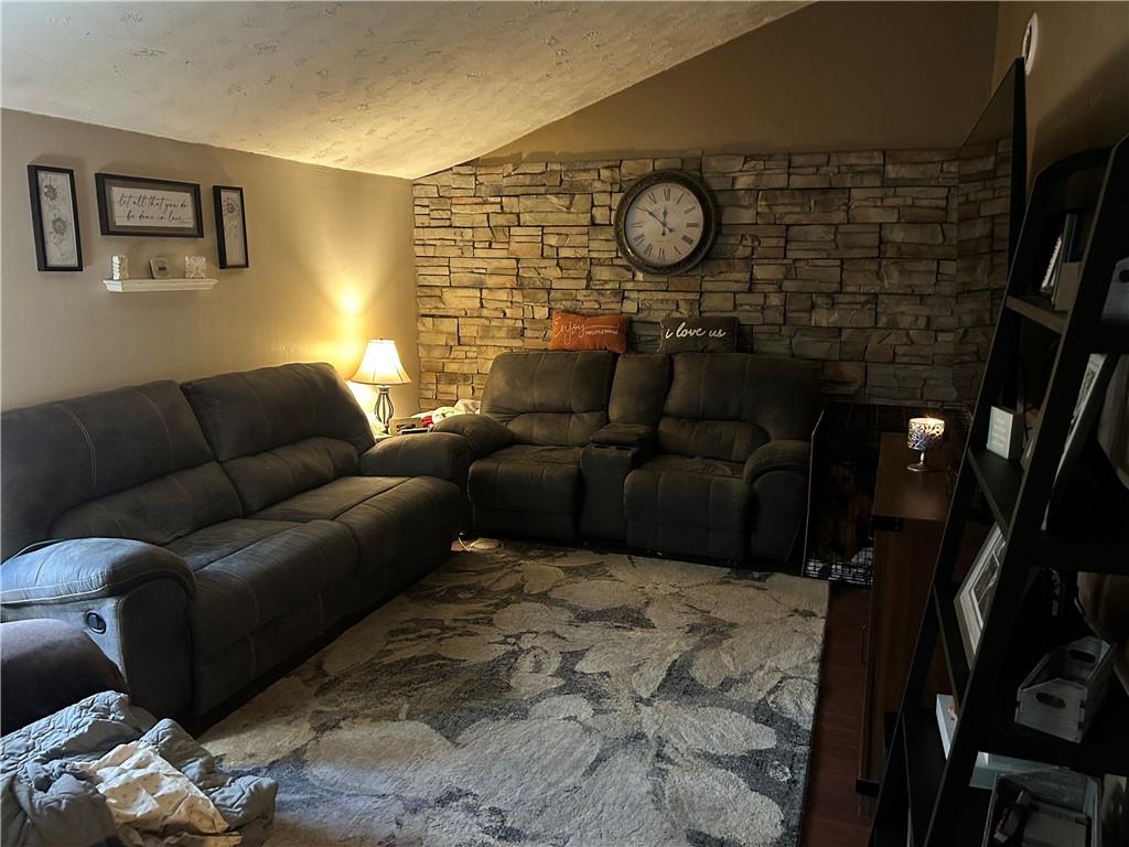 203 2nd Street Brownfield, PA 15416 - Photo 3 of 27 a living room with furniture a rug and white walls