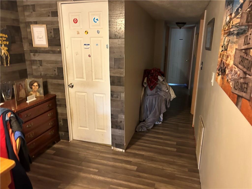 203 2nd Street Brownfield, PA 15416 - Photo 8 of 27 a view of a hallway with wooden floor and staircase