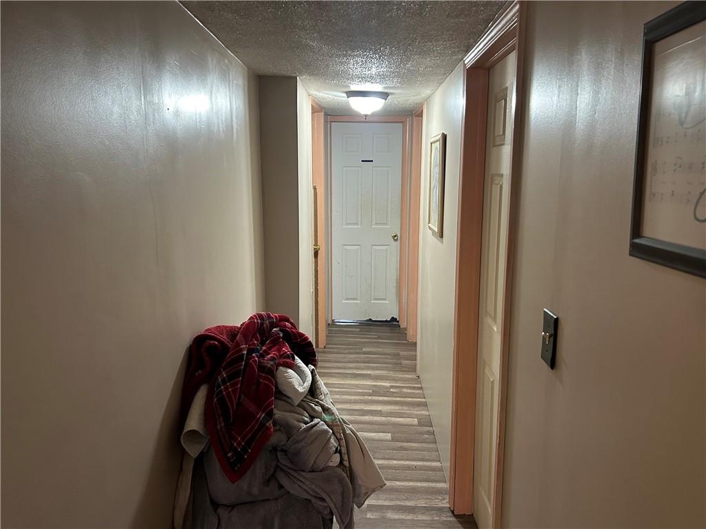 203 2nd Street Brownfield, PA 15416 - Photo 10 of 27 a bathroom with a mirror and a shower