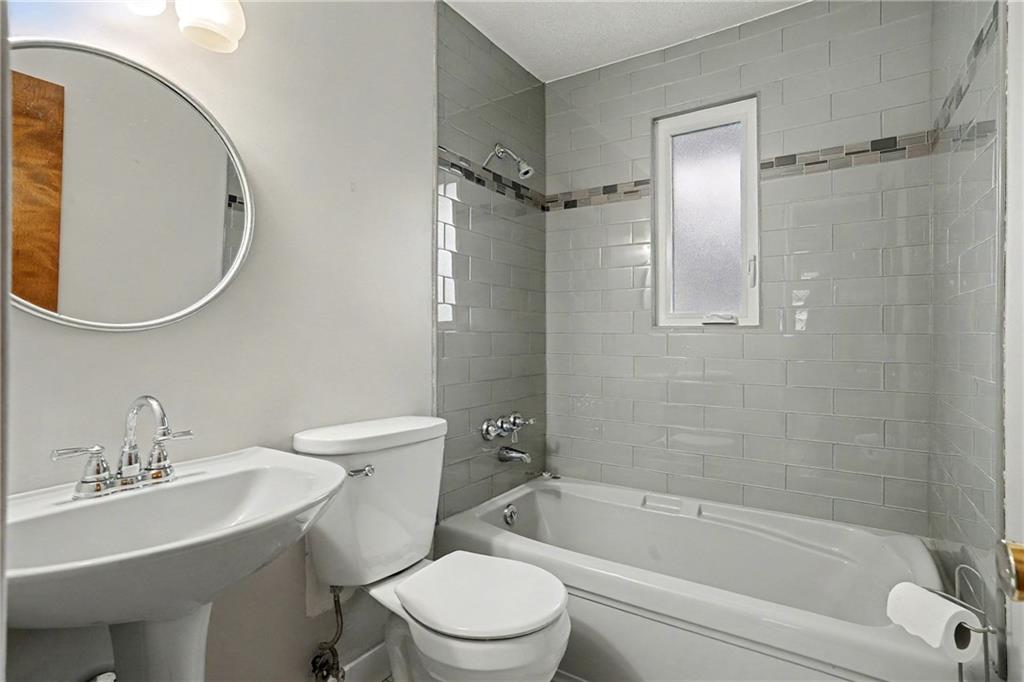 444 Violet Drive Lower Burrell, PA 15068 - Photo 12 of 19 a bathroom with a sink toilet and shower