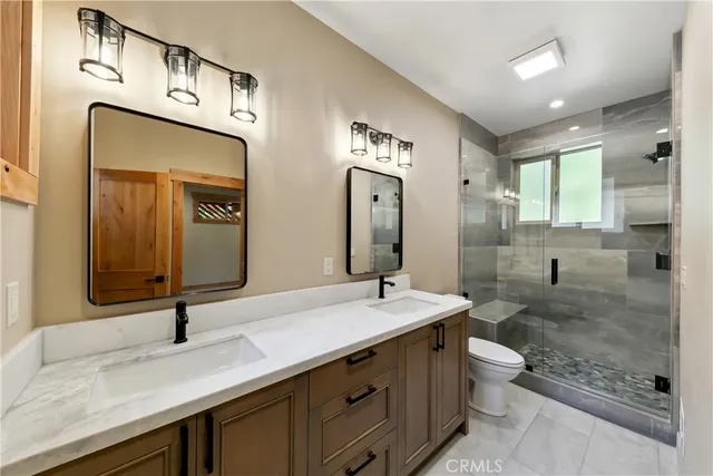 an empty room with windows and ceiling fan