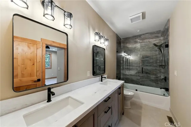 a kitchen with a stove sink and cabinets