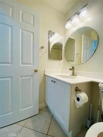 a bathroom with a double vanity sink and mirror