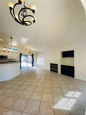 a view of a kitchen with furniture and a kitchen area