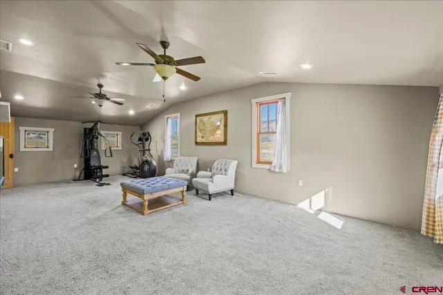 a view of livingroom with furniture and ceiling fan