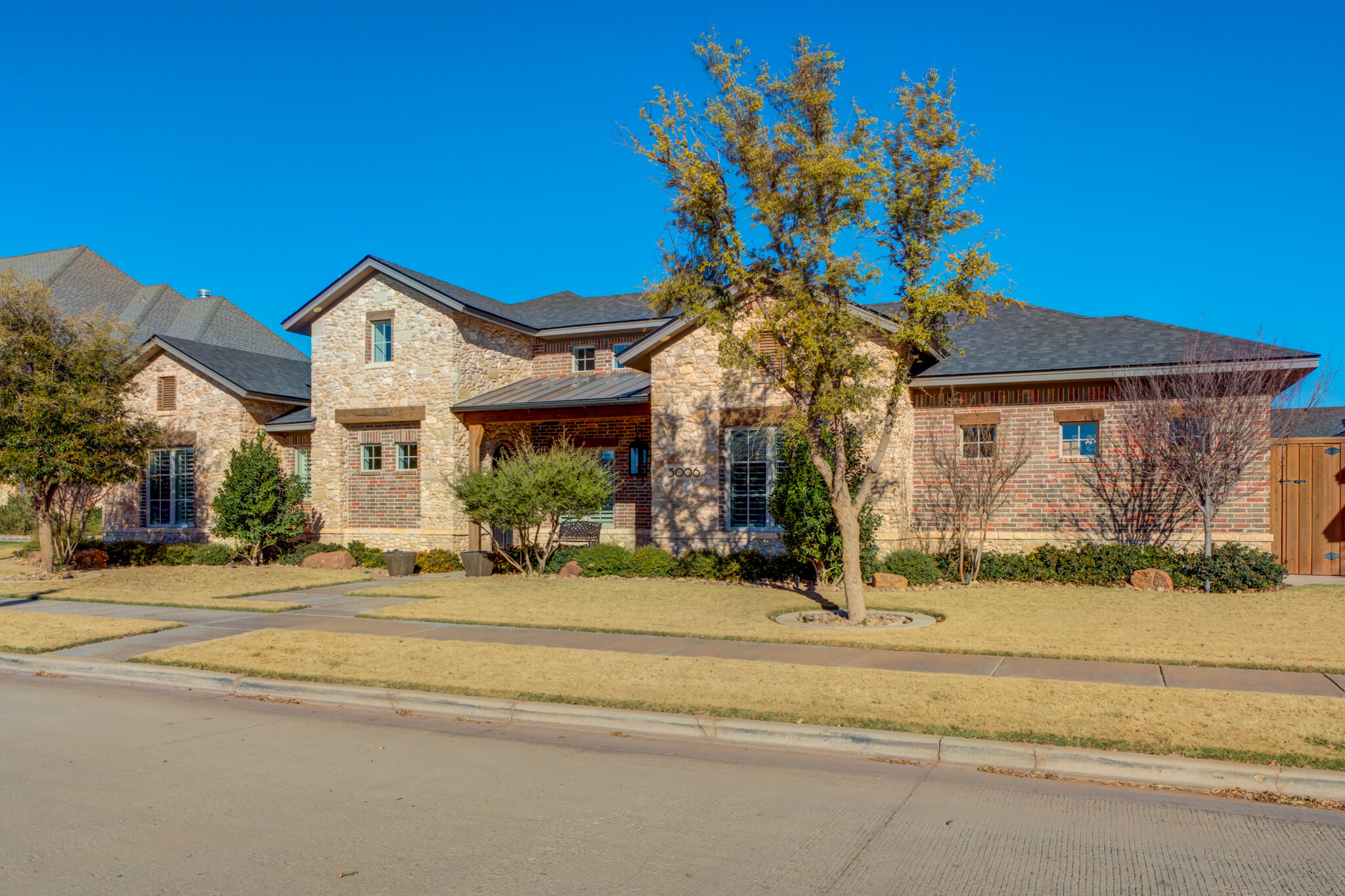 5006 117th Street Lubbock, TX 79424 - Photo 1 of 88 a front view of a house with a porch