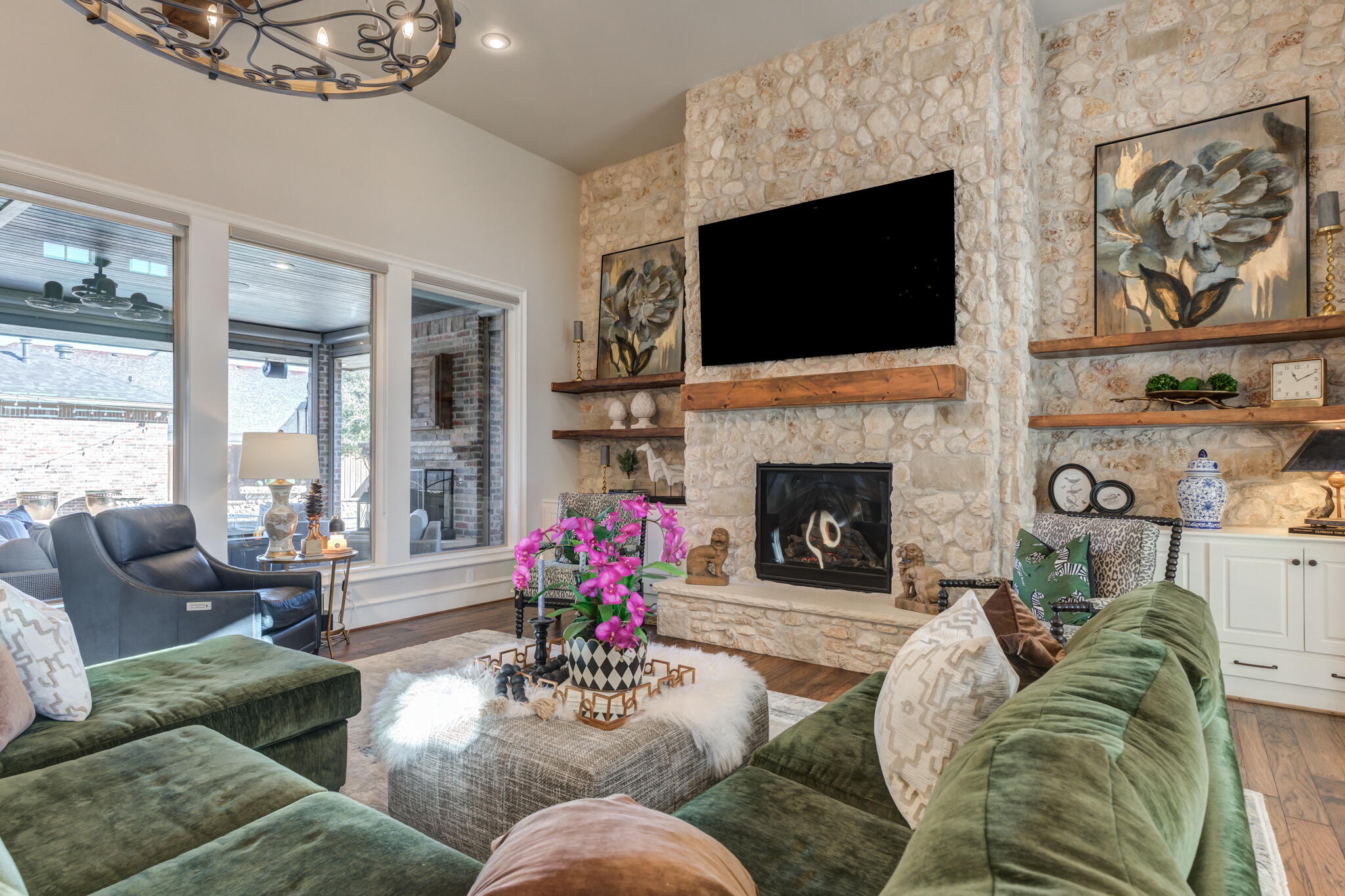 5006 117th Street Lubbock, TX 79424 - Photo 16 of 88 a living room with furniture fireplace and a flat screen tv