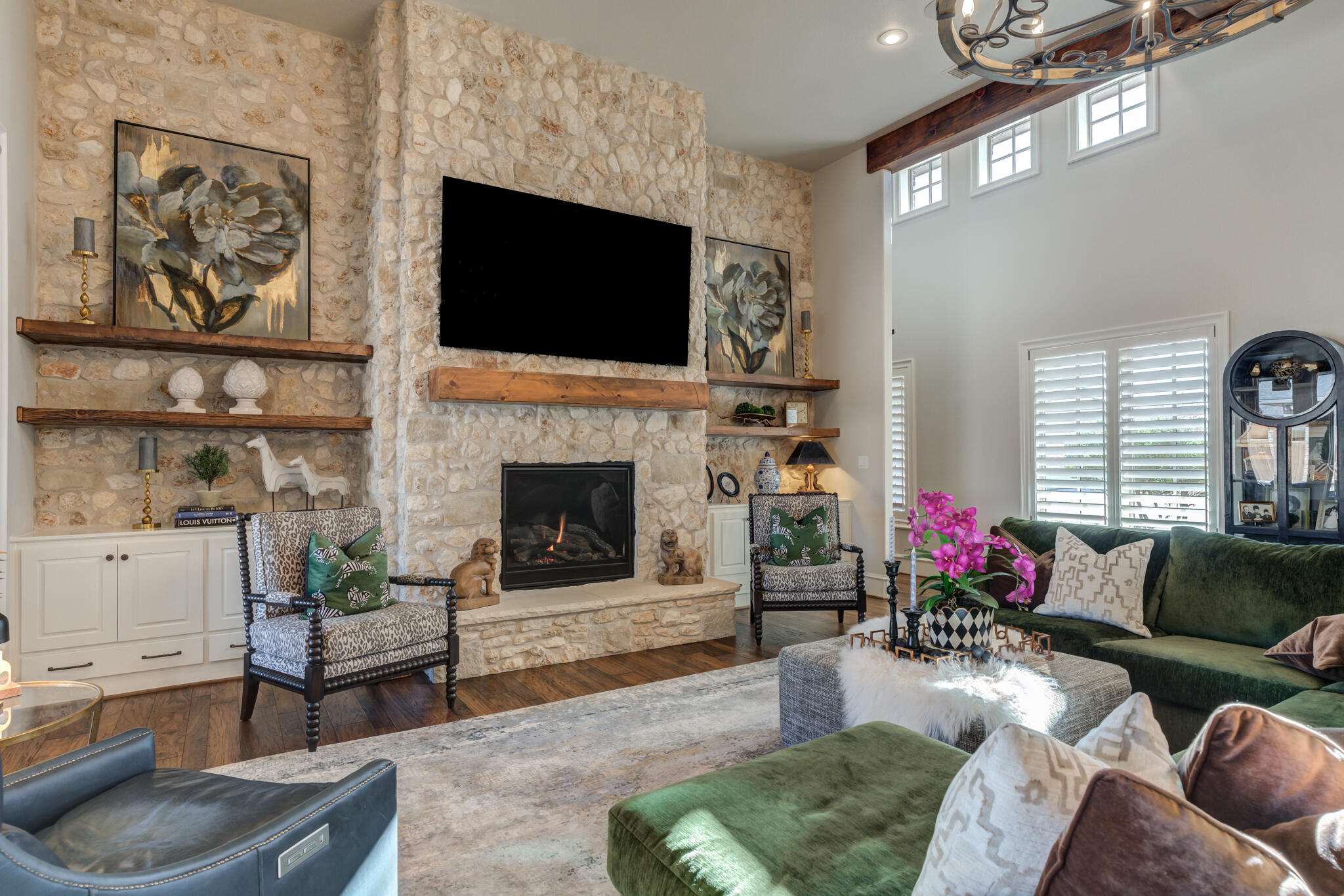 5006 117th Street Lubbock, TX 79424 - Photo 17 of 88 a living room with furniture a flat screen tv and a fireplace